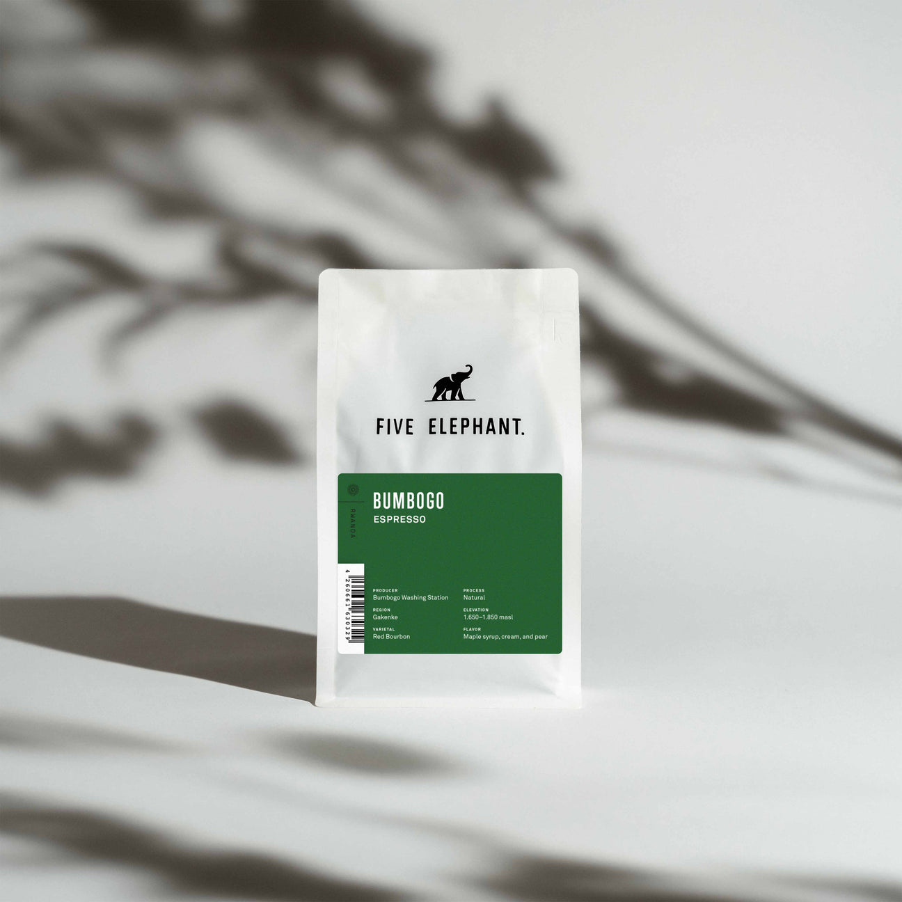 A white bag of coffee beans from Rosso Coffee Roasters